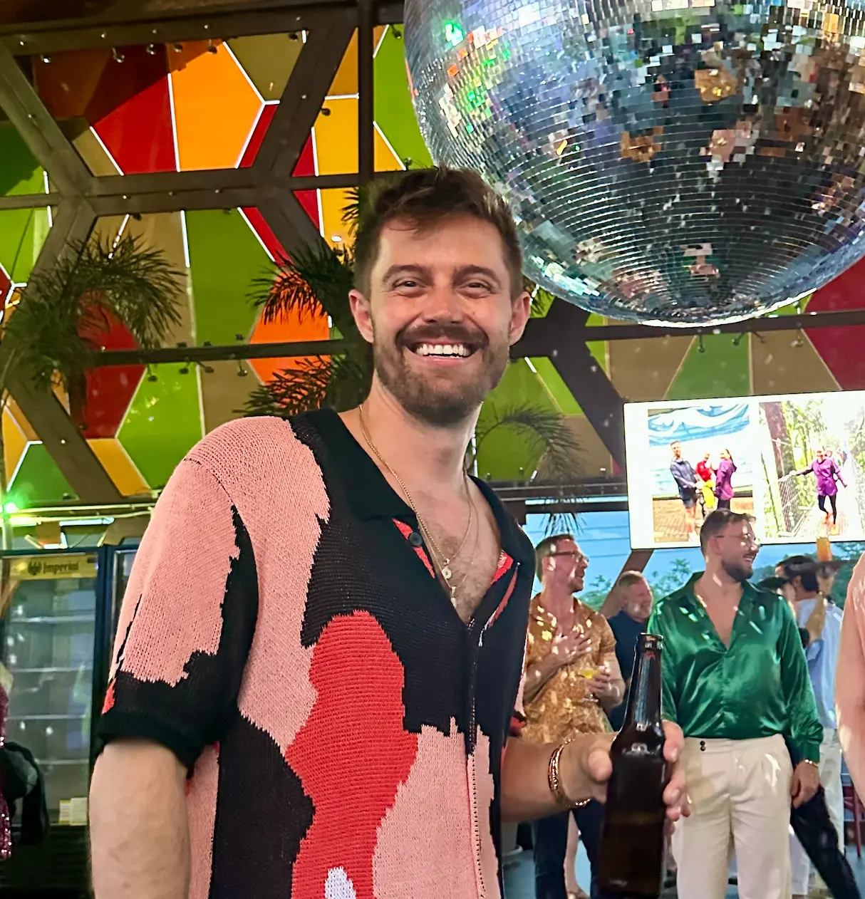 Eric smiling under a disco ball